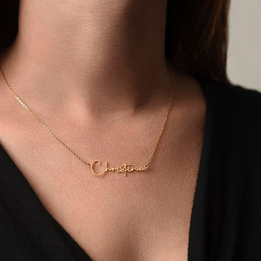 Personalized TrueScript Signature Necklace in 18K yellow gold showing the name 'Christina' worn on a model.